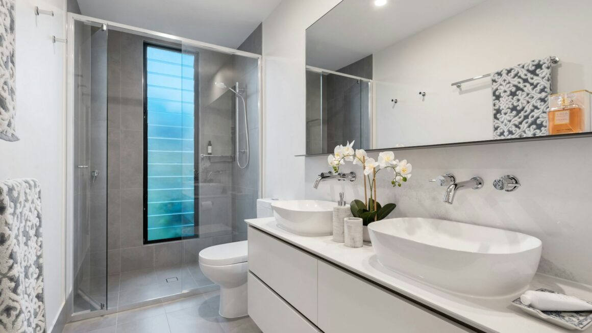 white ceramic sink with mirror