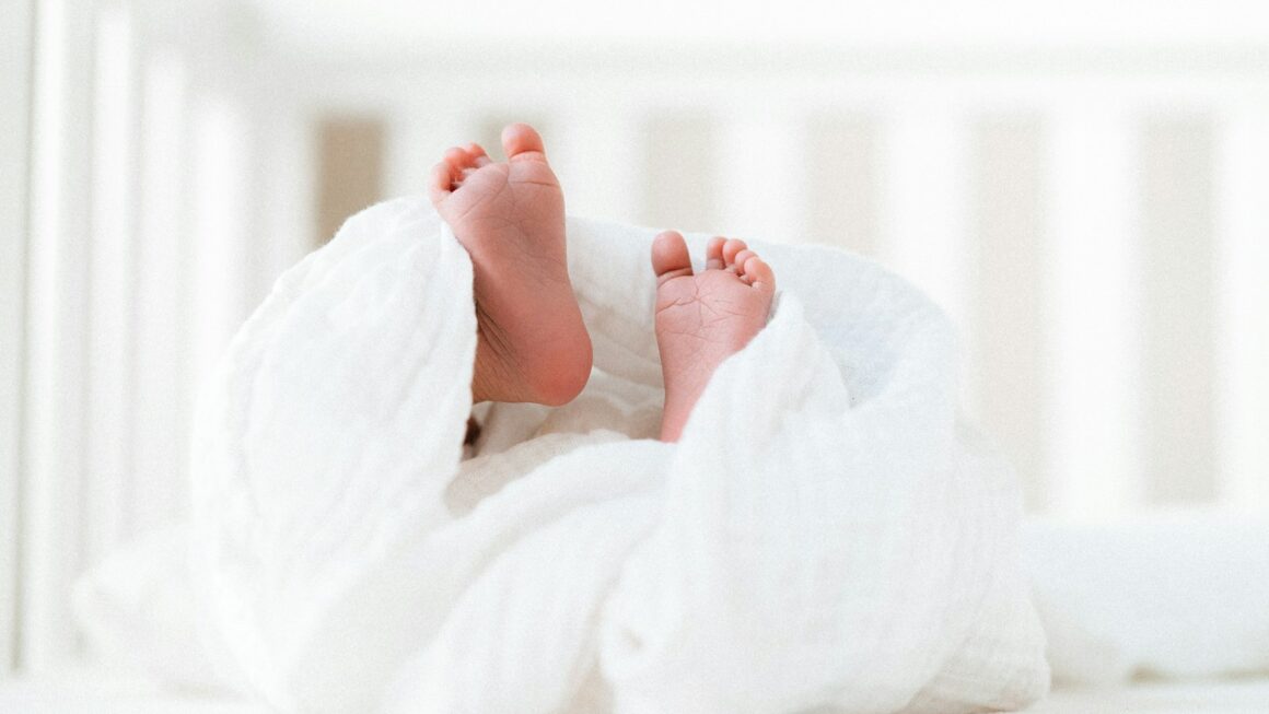 person covered with white blanket