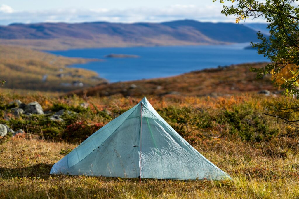 white tent on green grass field during daytime