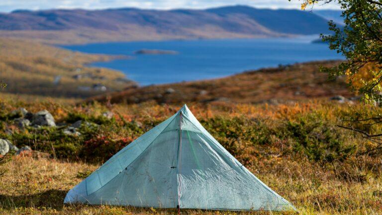 white tent on green grass field during daytime