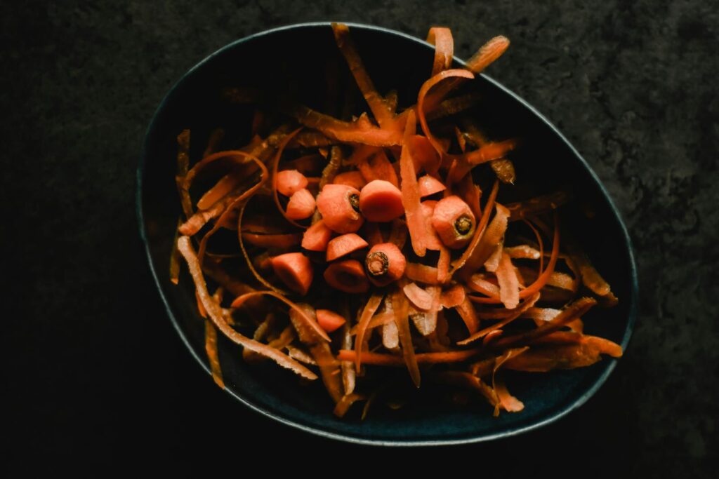 Carrots Peeling in a Bowl