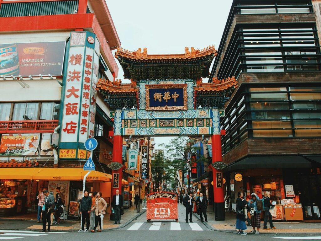 people walking in front of yokohama china town